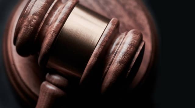 a brown wooden judge gavel